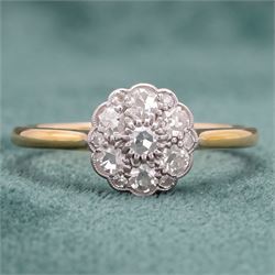 Early 20th century diamond daisy cluster ring, milgrain and bead set with thirteen old cut diamonds by Ahronsberg Brothers, stamped 18ct, total diamond weight approx 0.45 carat