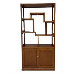 Hong Kong hardwood curio stand, six varied tiers, two base cupboards