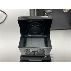 Yashica-A camera body, serial no. A4080073, with 'Yashikor 1:3.5 f=80mm' lens, serial no. 209272 and 'Yashikor 1:3.5f=80mm' lens, serial no 22942, together with Yashica TL-Electro camera body, serial no. 5054162 with 'Yashinon-DS 50mm 1:1.9  40056038