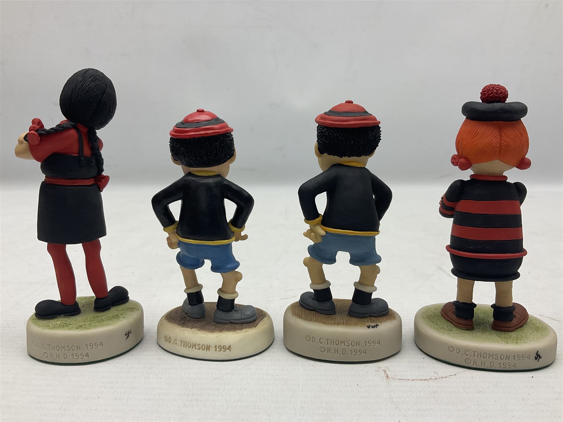 Fourteen Robert Harrop figures from the Beano Dandy collection, comprising Minnie the Minx BD04, Danny BD10, Biffo the Bear BD19, Spotty BD16, Smiffy BD09, Oops! BDS01, Little Plum BD27, Wilfrid BD15, Danny BD10, Winston BD17, 'Erbert BD14, Gnasher BD02, Beryl the Peril BD05 and Desperate Dan BD03, all with boxes