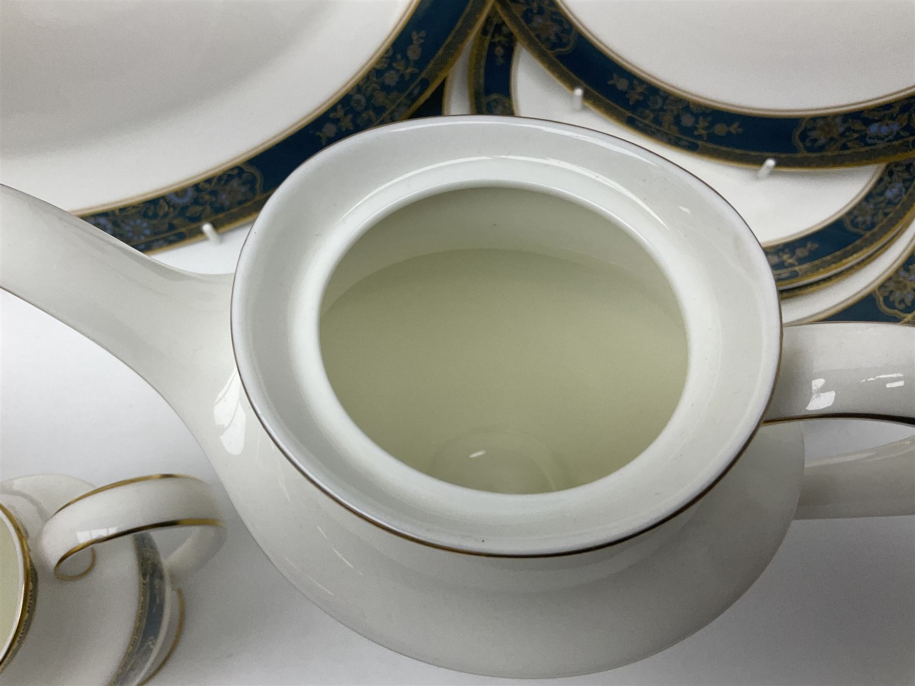 Royal Doulton Carlyle pattern tea and dinner service for six, to include teapot, coffee pot, teacups and saucers, coffee cups and saucers, milk jug, open sucrier, dinner plates, side plates, bowls, soup bowls, to covered dishes etc (64) 