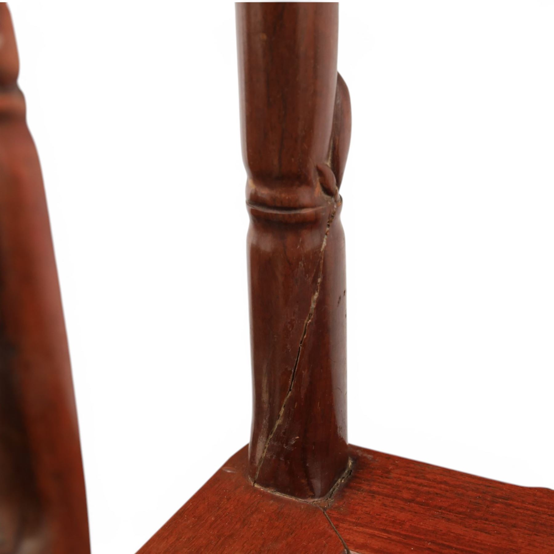 20th century Chinese ornately hardwood dining table and chairs, circular table with 'Lazy Susan' top with pierced carved frieze, raised on a quadriform base with carved foliate detail, the chairs en suite with carved pierced detailing  