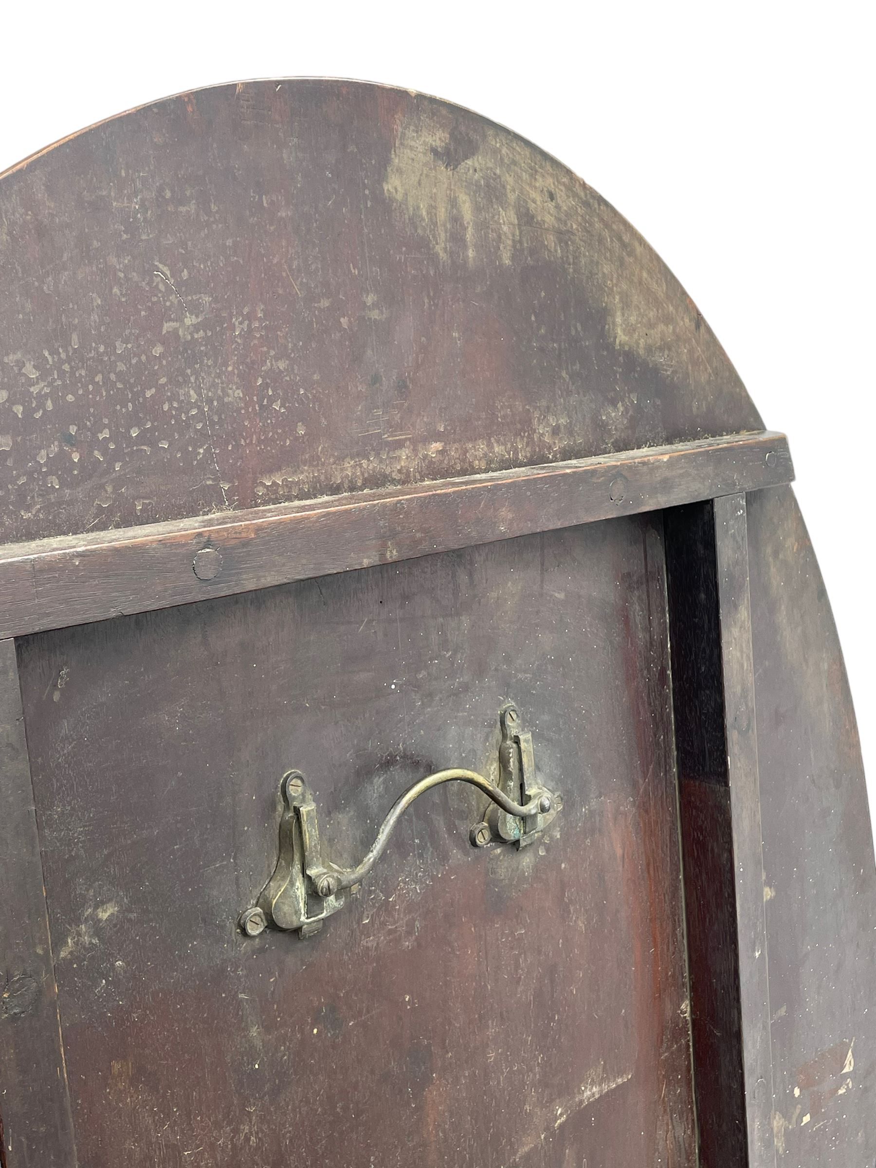 George III mahogany breakfast table, the oval top with a kingwood band and boxwood stringing, raised on a turned vasiform pedestal terminating in a fluted sabre tripod base with hairy paw feet and castors