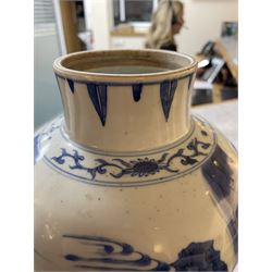 Pair of Chinese Kangxi blue and white porcelain vases, each of baluster form, painted with an outdoor scene containing figures seated upon the ground reading scrolls and holding fans, willow and bamboo tress, rock work and water, H27cm
