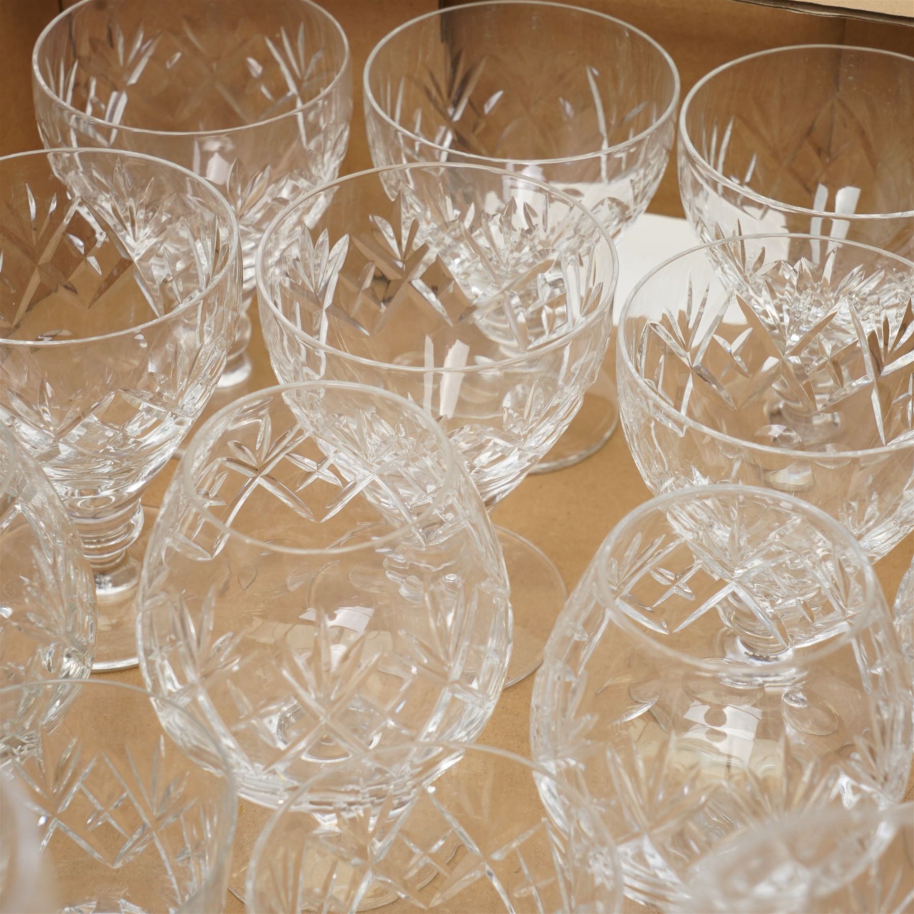 Quantity of Webb Corbett cut table glass including ten small tumblers, six claret glasses, brandy balloons etc and eight Royal Doulton champagne flutes