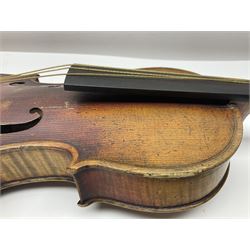 Late 19th century French three-quarter size 'Conservatory' violin with 34cm two-piece maple back and ribs and spruce top, the peg box inscribed 'Conservatory Violin Straduari', bears label 'Antonius Stradiuarius Cremonensis Faciebat Anno 1721' L55.5cm overall; in ebonised wooden 'coffin' case; and Saxony violin c1900 with 36cm two-piece maple back and ribs and spruce top; bears label 'Antonius Stradivarius Cremonensis Faciebat Anno 17**' L59cm overall; in carrying case (2)
