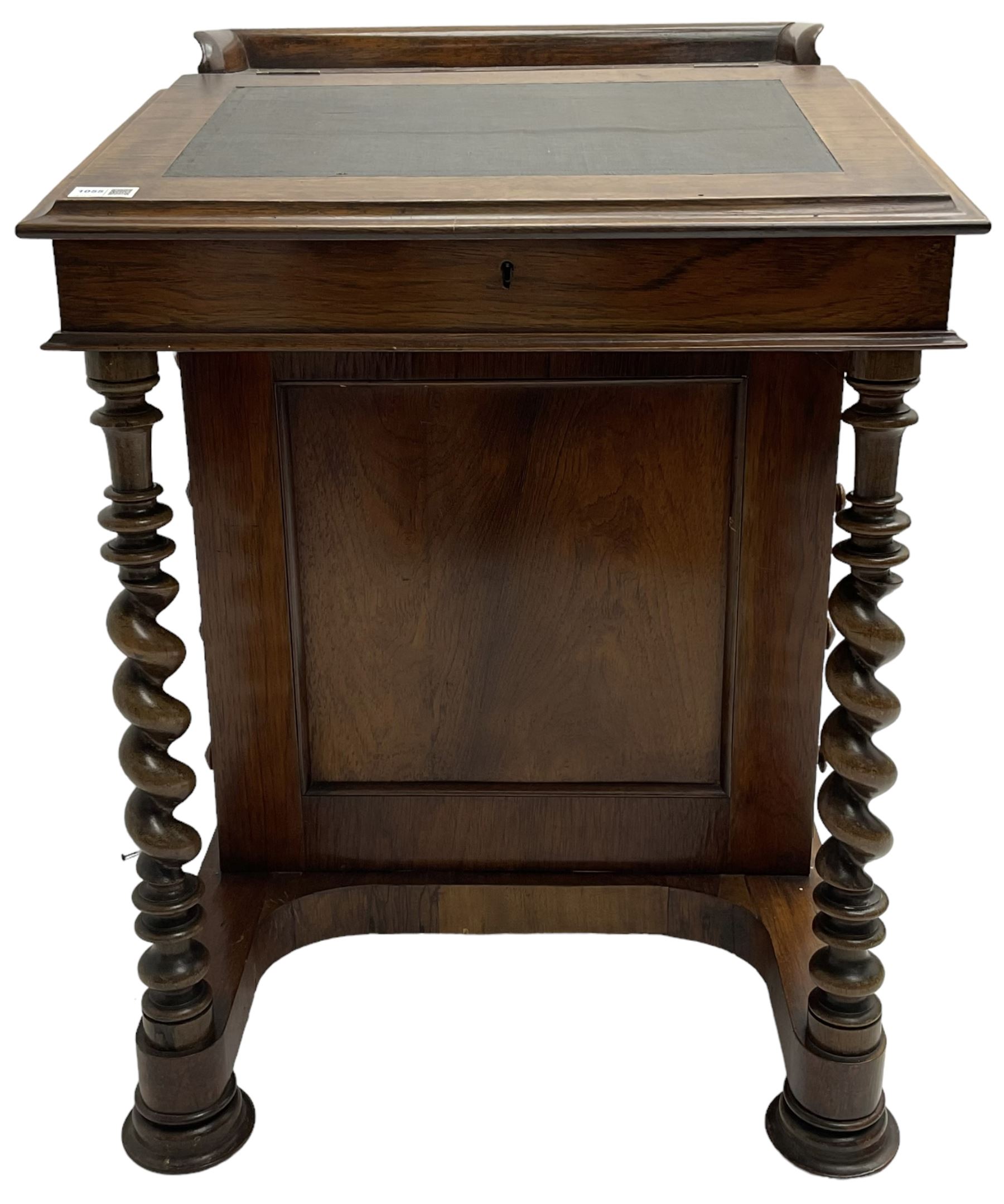 Victorian walnut Davenport, hinged sloping top with inset leather writing surface, enclosing satinwood lined interior with two drawers over faux drawer, fitted with inkwell drawer and pen compartment to the side over four drawers with an opposing false set, raised on spiral turned supports united by a shaped platform base