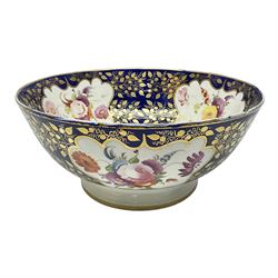 19th century continental bowl, decorated with hand painted floral sprays amongst gilt foliate decoration on a cobalt blue ground, D27.5cm