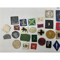 Approximately one-hundred printed and embroidered cloth badges including I, II, VIII, XI, XII and XXX Corps, Eastern Command, various Armoured Divisions, Midland, Wessex, Home Counties and 12th Infantry Brigades, Salisbury Plain, Northumberland, Hampshire, North Midland, West Riding, Essex and Suffolk Districts, Berlin & Rhine Army Troops etc