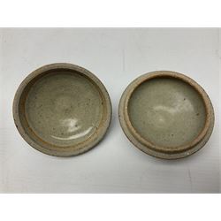 Janet Leach (American, 1918-1997) for Leach Pottery; speckled studio pottery vase of shouldered ovoid form with speckled brown decoration and trailing green and brown glaze upon beige and brown ground, with impressed J.L. monogram and Leach Pottery mark beneath, together with a Jeremy Leach blue speckled lidded circular dish with loop handle, impressed J.L, tallest H11cm