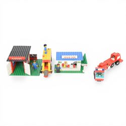 Nine vintage Lego Classic Town vehicles and buildings,  comprising no. 368-1 Taxi  Station, no. 675-1 Snack Bar, no. 374-2 Fire Engine, no. 643-2 Mobile Crane, no. 361-2 Garage, no. 00-2 Weetabix Promotional House, no. 6693 Recycle Truck, no. 6450-1 Mobile Police Truck and no. 6358 Snorkel Squad, all built with minifigures