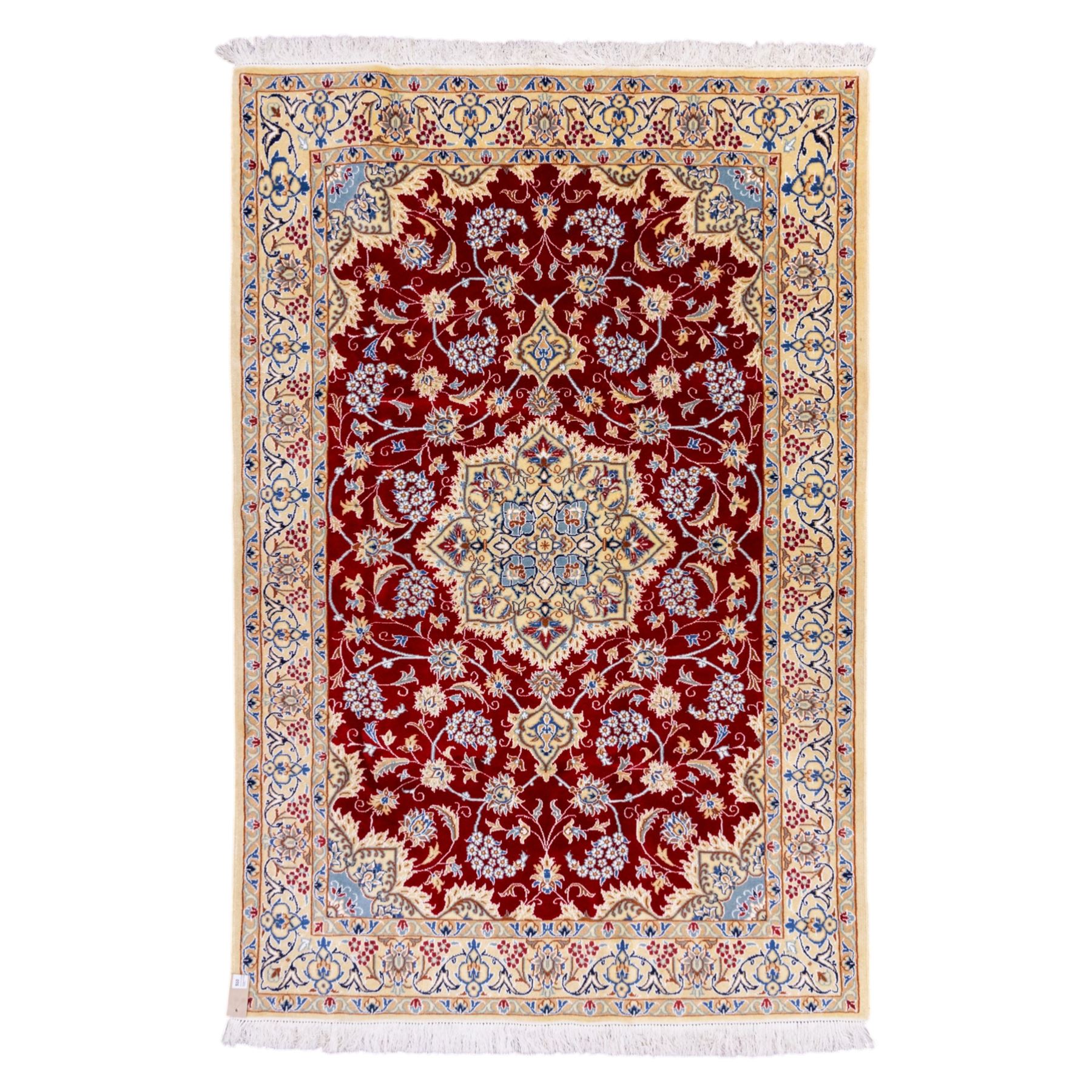 Central Persian Nain hand-knotted rug, crimson field, with central ornate ivory medallion with scrolling arabesques and flowering vine ornaments within a dense floral lattice framed by pale blue corner spandrels and enclosed with an ivory border of scrolling vine and palmette decoration between multiple guard stripes, with cotton fringe ends 