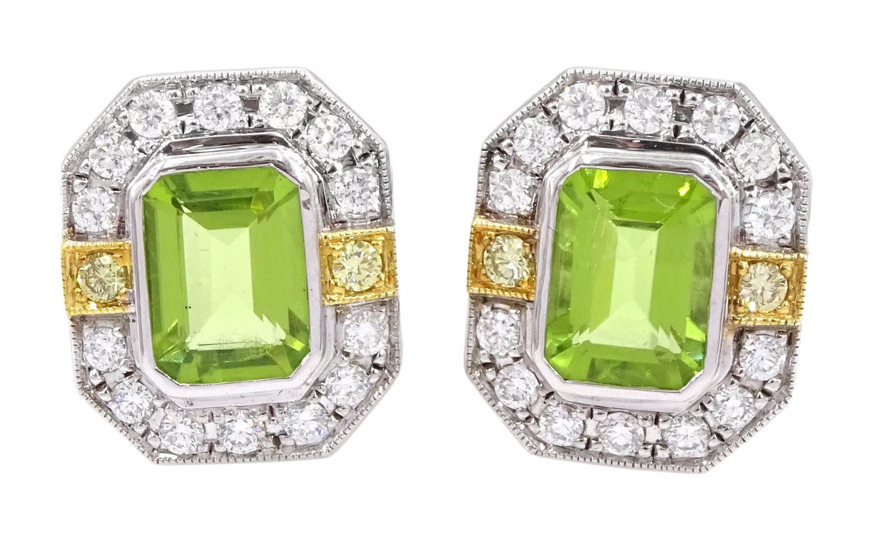 Pair of 18ct white and yellow gold emerald cut peridot and milgrain set round brilliant cut diamond stud earrings, total peridot weight 3.11 carat, total diamond weight 0.70 carat, with World Gemological Institute report
