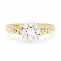 18ct gold diamond flower head cluster ring, set with nine round brilliant cut diamonds, wi...