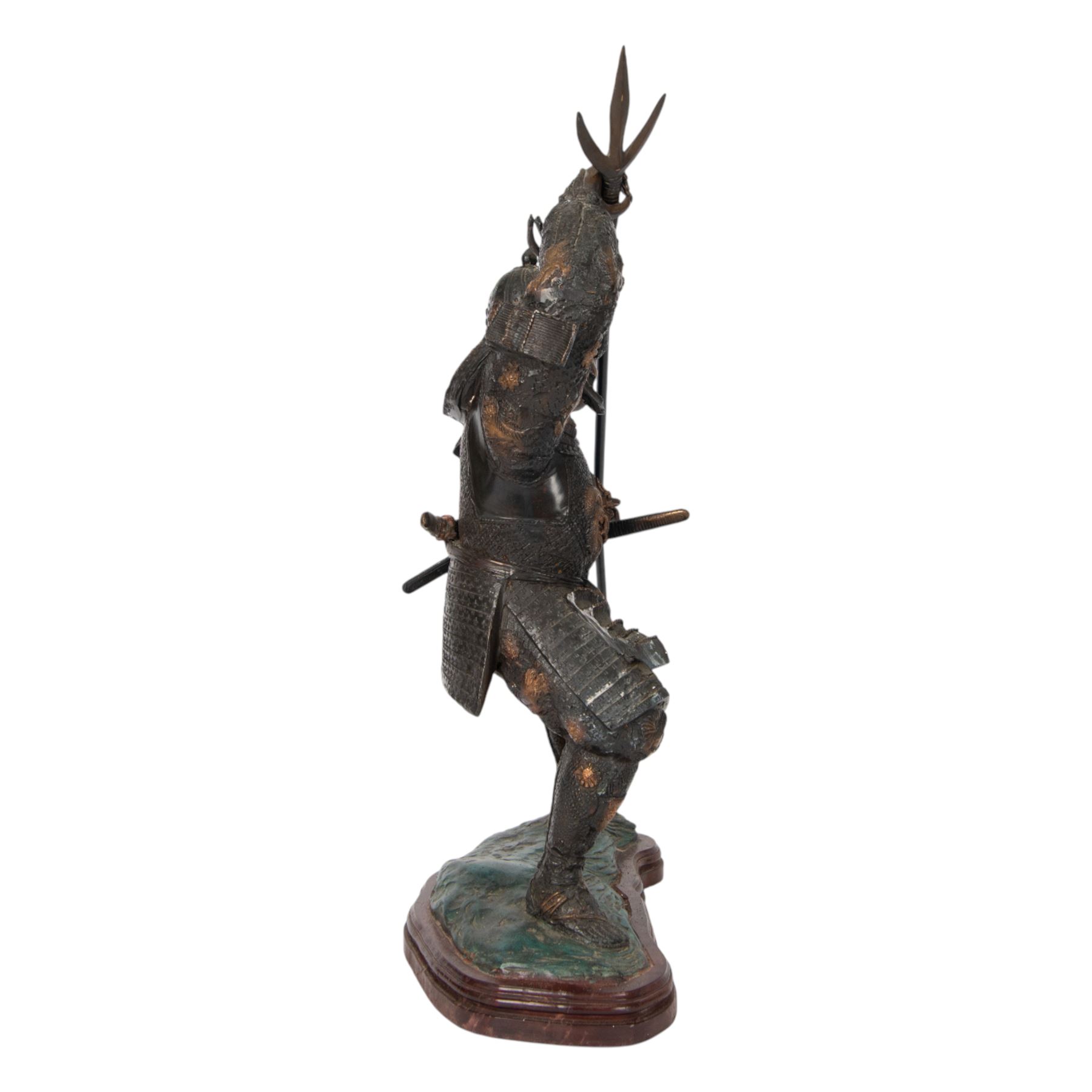 Japanese bronze of a Samurai, possibly Meiji period, standing holding a three pronged spear, on a wave form base, H67cm