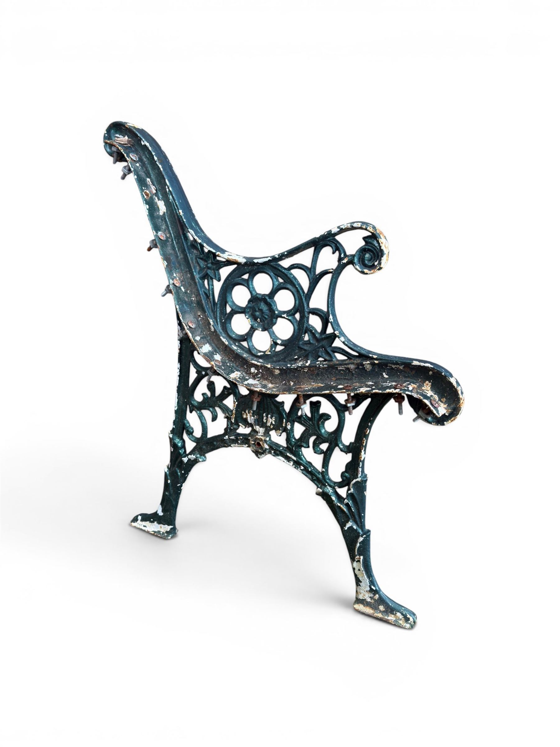 Pair of ornate painted cast iron bench ends, painted in green