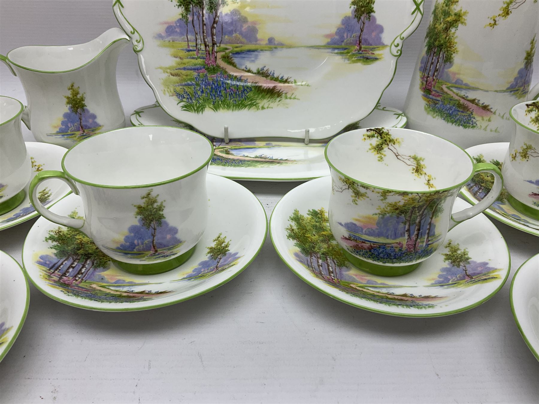 Aynsley Bluebell Time 'As Supplied to the Queen' tea service, comprising hot water jug, six teacups and saucers, milk jug, two cake plates and tow trinket dishes  
