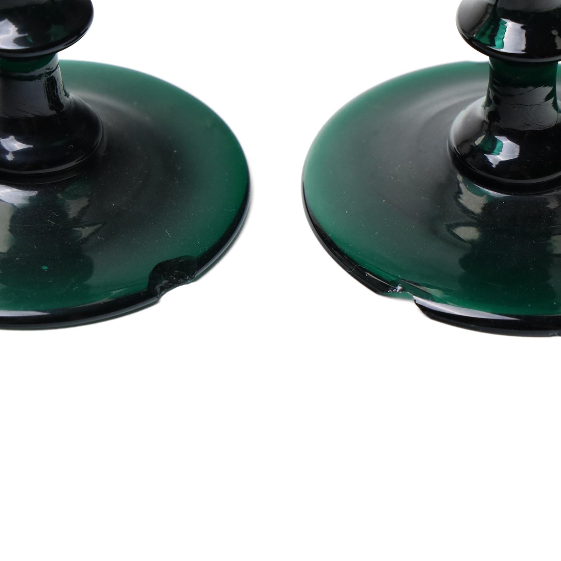 Five green wine glasses of early 19th century design with conical bowls and double knop stems on a circular foot, with pontil marks, pair of green wine glasses with chamfered stems together with an Asprey catalogue of green glass 1740-1840 and two pieces of glass fruit and leaves