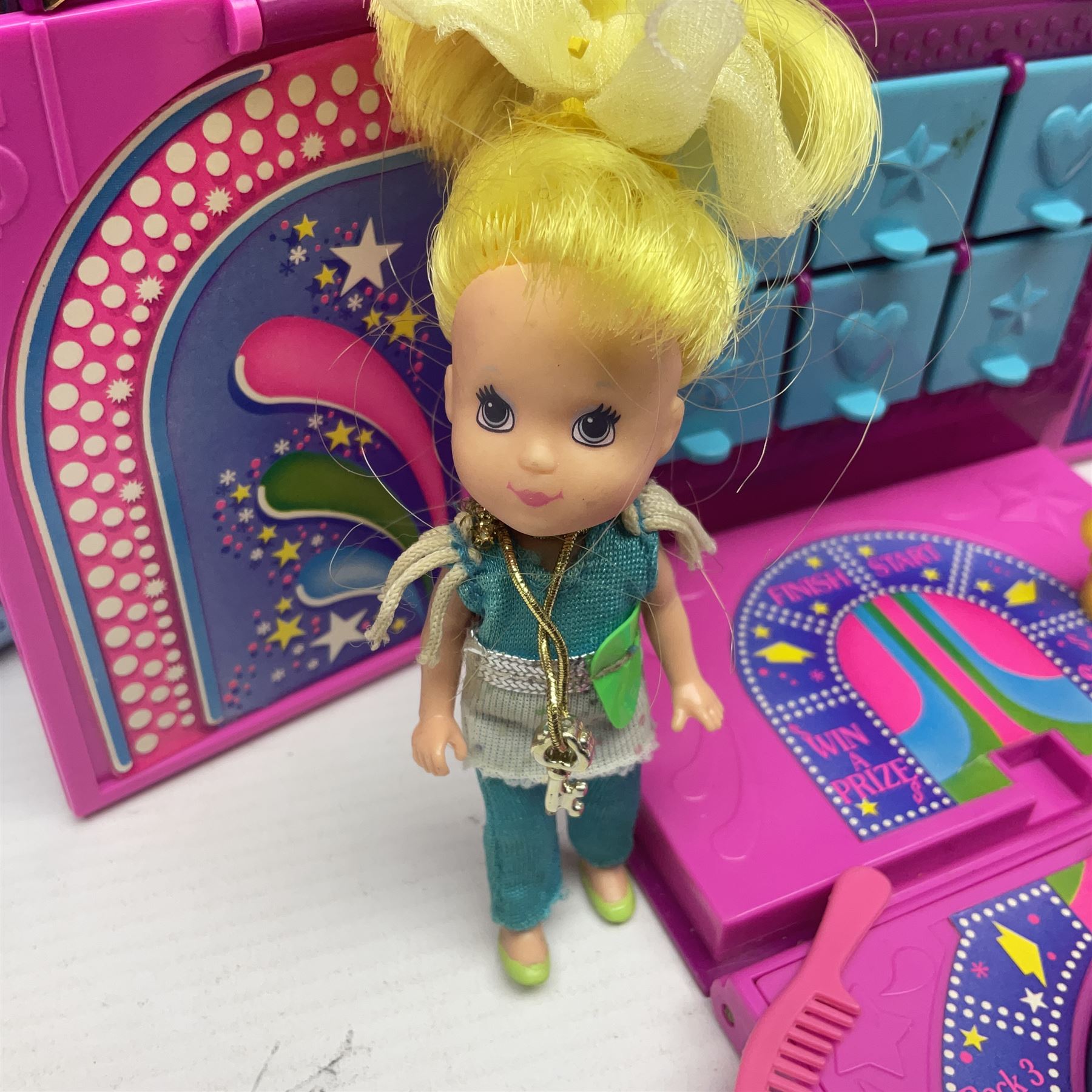 Wish World Kids - Eleven play sets comprising Treats ‘n Sweets Refrigerator, Grin ‘n Win TV, Sponge ‘n Plunge Bathtub, Socks ‘n Locks Dresser, Spice ‘n Slice Stove, Sleep ‘n Leap Bed, File ‘n Smile Desk, Blaze ‘n Braise Fireplace, Hear ‘n Cheer playset in Sponge ‘n Plunge box, two Read ‘n Speed Chair playsets in one box