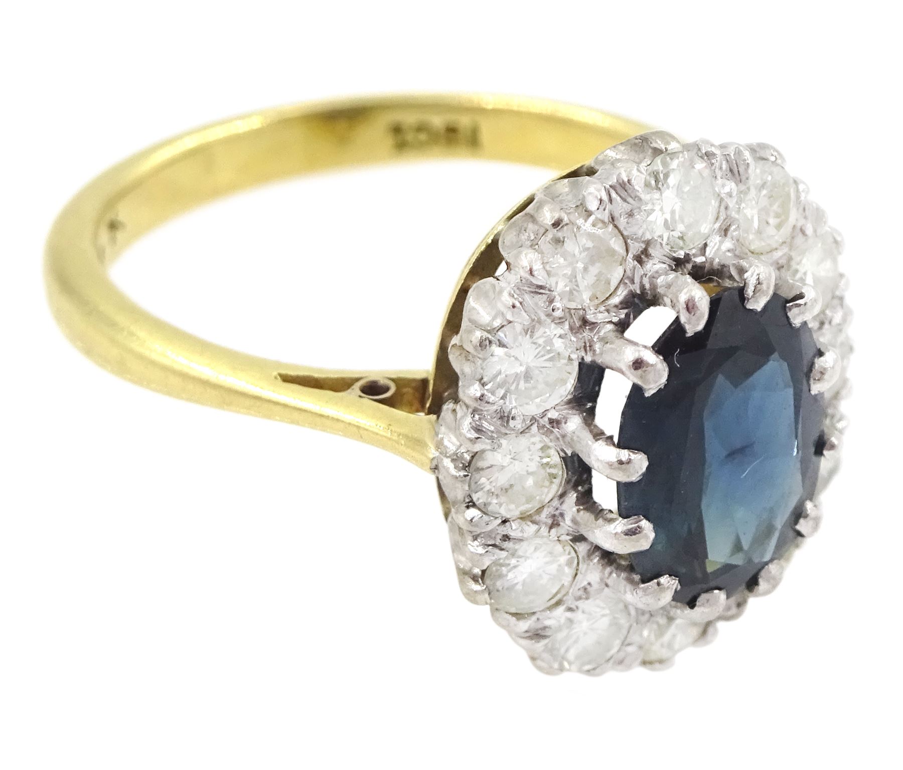 Gold oval cut sapphire and round brilliant cut diamond cluster ring, stamped 18ct, sapphire approx 1.50 carat, total diamond weight approx 0.60 carat