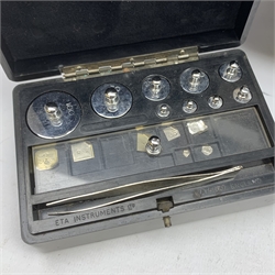 Set of cased brass and chrome laboratory scales by J.W. Towers Widnes Model 75, with black vitrolite type base, upward sliding front and hinged side doors, W40cm H47cm; with bakelite cased set of weights by ETA Instruments Ltd