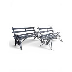 Coalbrookdale - rare pair of wrought iron and slatted wood garden benches, the twin wrought iron strapwork bench-ends formed of four scrolls over splayed feet, number 77 in the Coalbrookdale Castings Catalogue (see illustration)