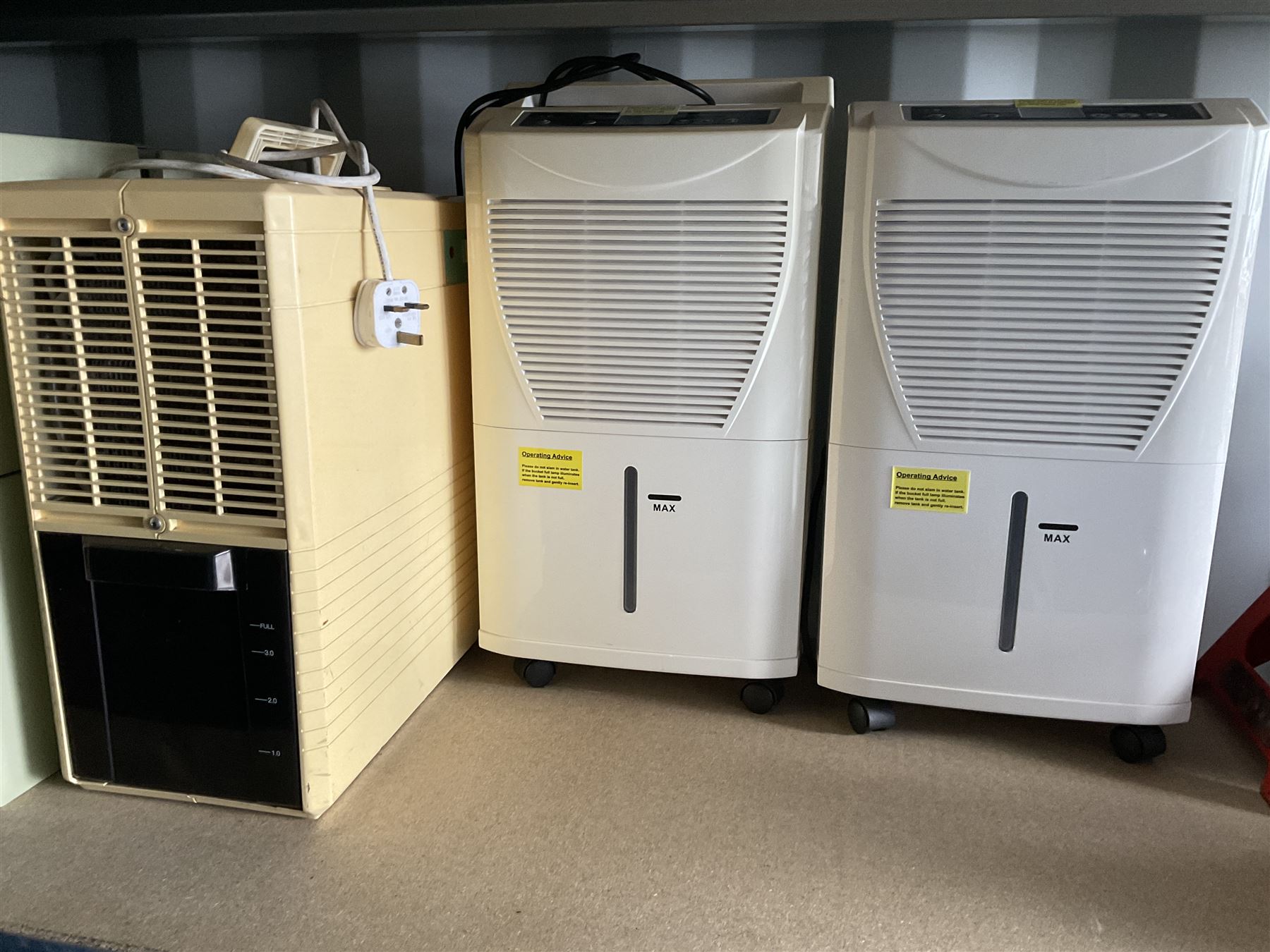 Set of three dehumidifiers and One Concept upright mini washing machine  - THIS LOT IS TO BE COLLECTED BY APPOINTMENT FROM DUGGLEBY STORAGE, GREAT HILL, EASTFIELD, SCARBOROUGH, YO11 3TX