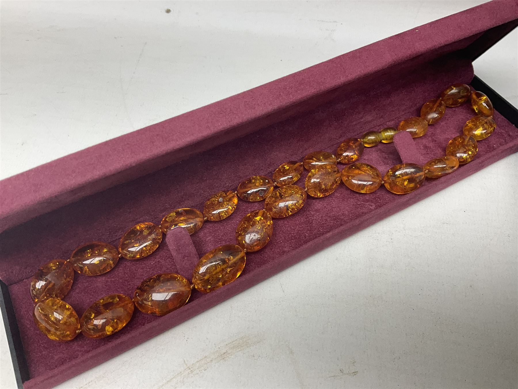 Silver-gilt drip design Lucy Q necklace, designed by Lucy Quartermaine, amber necklaces, silver-gilt stone set heart pendant, 10ct gold single stone set stud earrings, silver interchangeable pearl hoop earrings and a collection of costume jewellery and wristwatches 