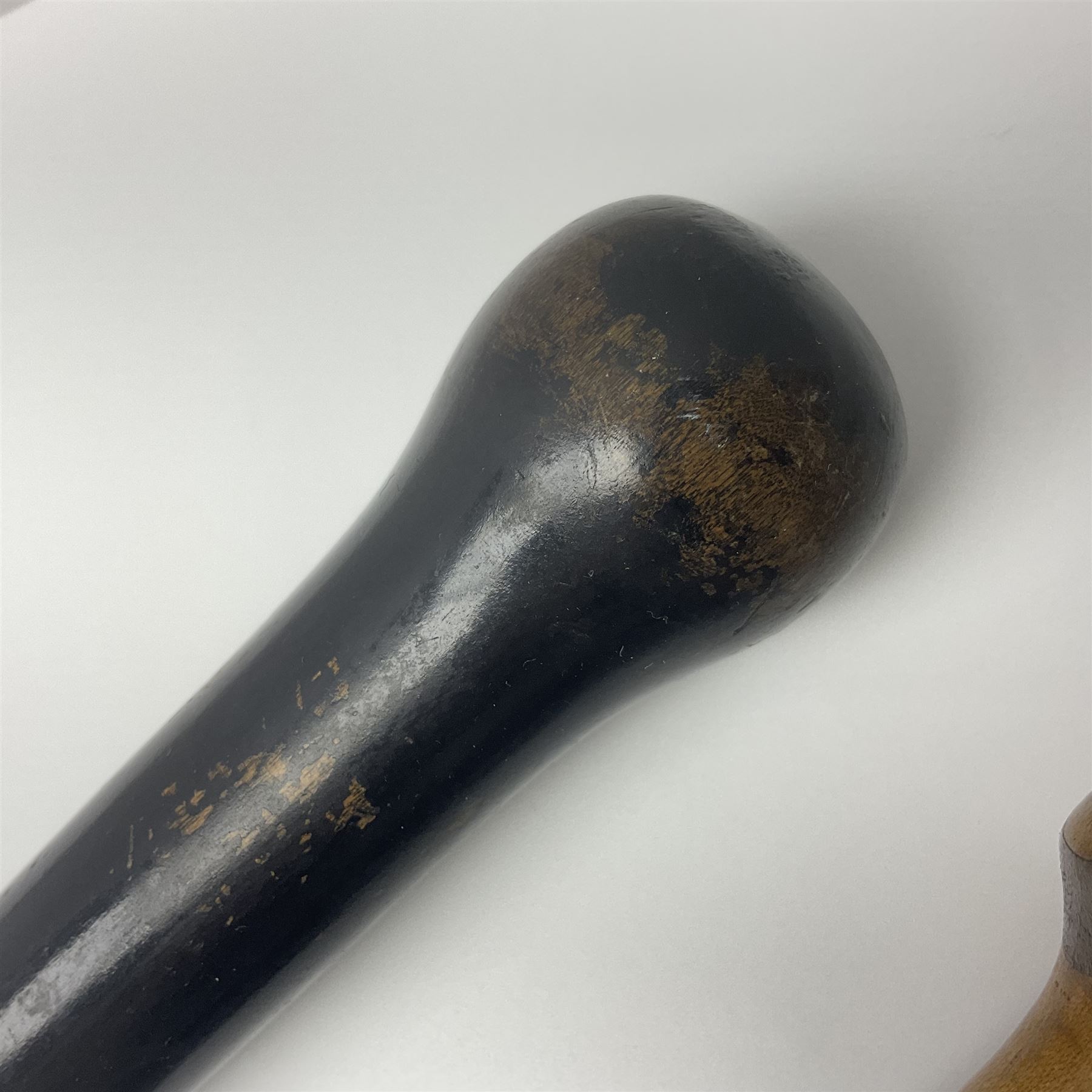 Two ebonised walking sticks, one with 'Leeds City Police' embossed top, tallest H92cm