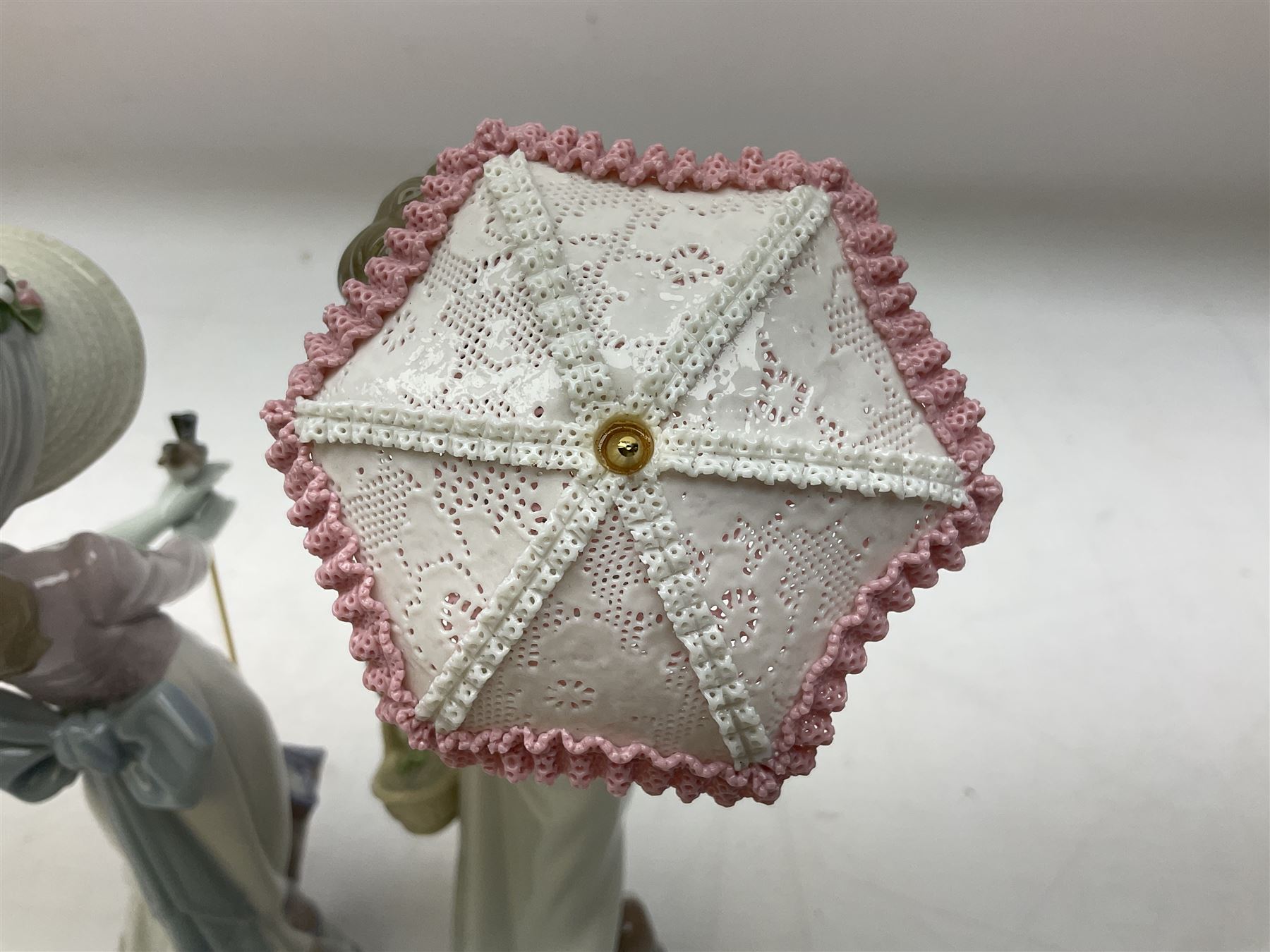 Two Lladro figures, comprising Garden Classic, no 7617 and Garden Song, no 7618, with original boxes and artists signature beneath, largest example H23cm