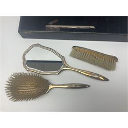 Modern silver four piece dressing table set, comprising hand mirror, hair brush, clothes brush and comb holder, each with engine turned and floral engraved decoration, hallmarked W I Broadway & Co, Birmingham 1974, in velvet and silk lined fitted case