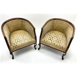 Early 20th century mahogany framed two seat settee, upholstered in a pale gold fabric, cabriole feet (W125cm) and two matching tub shaped armchairs (W62cm)