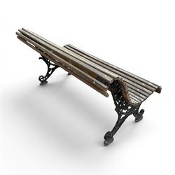 19th century cast iron and wood slatted garden bench, serpentine scroll form, ornate bow ends finished in green paint