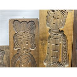 Six 20th century hardwood Dutch folk art Speculaasplank or biscuit moulds, typically carved with figures in traditional dress, largest H101cm
