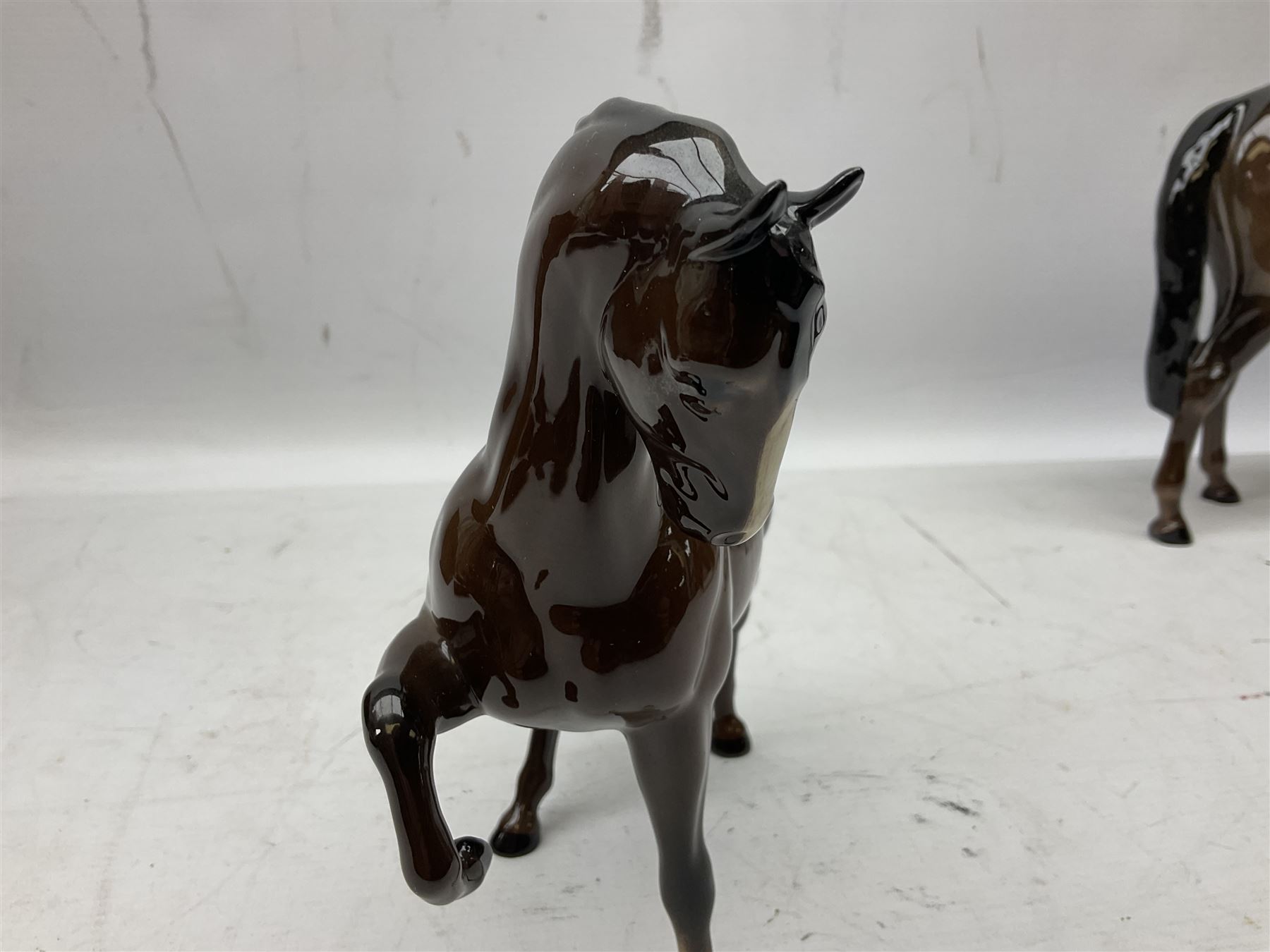 Six Beswick figures of bay horses, including large hunter no.1734, Shire horse no.818, horse with tucked head no.1549, etc (6)