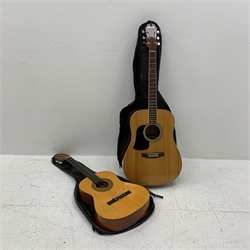 An acoustic Aria guitar, model no AW-20- LH N, together with a 3/4 acoustic Herald guitar, model MG104N. (2). 
