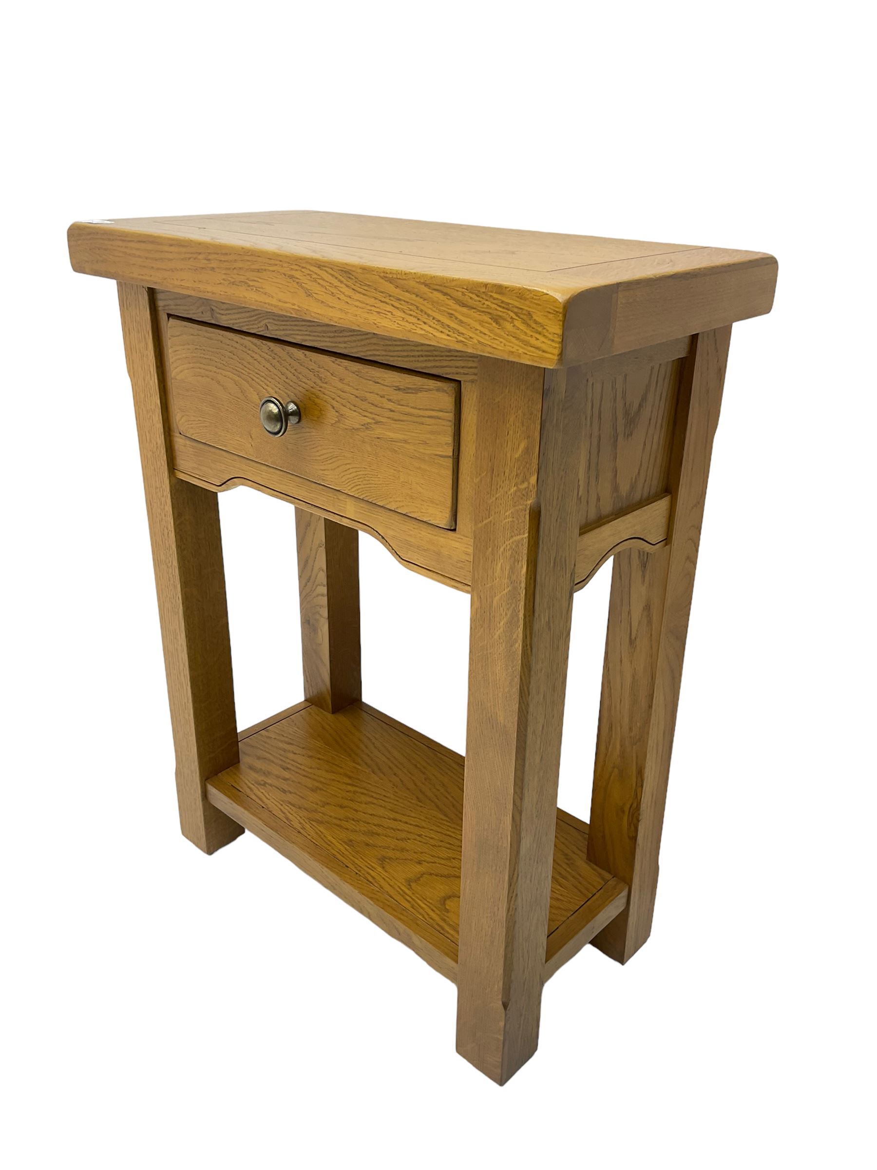 Solid light oak side table, fitted with single drawer, raised on square