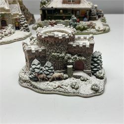 Five Lilliput Lanes, comprising Christmas at Woody Bay Station and Calling Home for Christmas both from the Illuminated collection, Castle of the Exiled Prince, Castle of The Ransomed King and Helvellyn, all with original boxes (5)