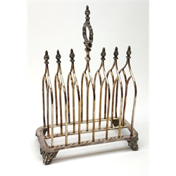 Victorian electroplate Gothic style toast rack, with seven arched bars, openwork handle and arcaded bracket feet, marks for John Gilbert, H25cm   