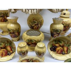 Collection of Aynsley Orchard Gold pattern wares, comprising lamp base, three jars and covers, six vases or various size and form, large jug, lidded dish, pair of cruets, pair of candlesticks, mug, two pin dishes, lobed dish, tea cup, saucer, size plate, and cake plate, and two further cups and saucers, each cup decorated with central Orchard Gold reserve to the interior against a mottled pink or green ground. 