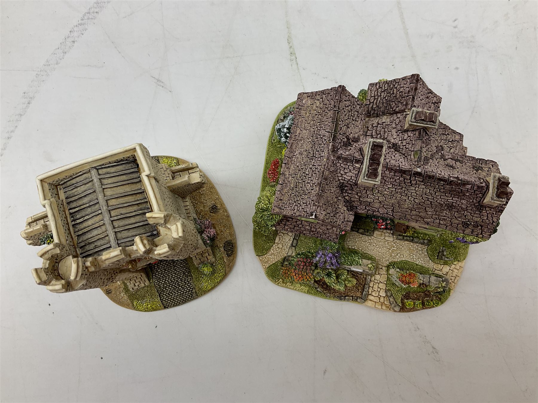 Four Lilliput Lane models from the 'Britain's Heritage' collection, comprising Edinburgh Castle, The World Famous Blacksmith's Shop Gretna Green, Shakespeare's Birthplace and Mickelgate Bar York, together with  a Lilliput Lane Beatrix Potter Hill Top model, all boxed