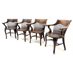 Set eight early 20th century oak captains chairs, carved scrolling cresting rail, tapering stick back, cabriole legs joined by stretchers 