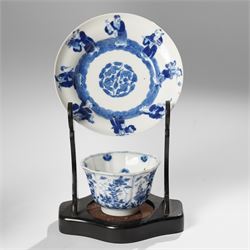 Collection of 18th century blue and white Chinese tea wares, comprising girl on swing saucer and tea bowl, boy riding buffalo tea bowl, one wine cup with foliate rim with Artemisia leaf mark to base, and similar with lotus mark to base, miniature vase, small teabowl with six character reign mark possibly Chenghua, Daoguang saucer, and others, mostly unmarked (13)