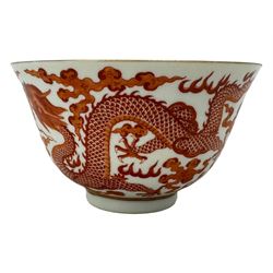 Chinese porcelain iron red tea bowl, the exterior painted with two five claw dragons chasing the flaming pearl, amidst clouds, red Quinlong seal mark beneath, D10.5cm x H6.5cm