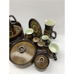 Denby Arabesque pattern tea and dinner wares, comprising large serving bowl,  five dinner plates, three side plates, four twin handled bowls and covers, one bowl and cover, four bowls, salt and pepper shaker, pan with lid, six egg cups, small serving dish, coffee pot, water jug, milk jug, jug with handle,  two sucriers and covers, four tea cups and one coffee