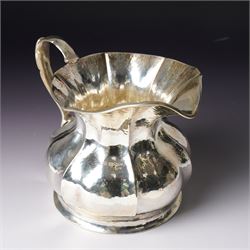 Italian 800 standard planished silver water jug of panel sided design with scroll handle  H14.5cm retailers label Bello di Frison, Padova