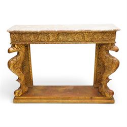 Pair of carved giltwood and composition console or pier tables, rectangular variegated rouge marble top, the frieze decorated with trailing vine and grape bunches, eagle front supports on stepped rectangular base