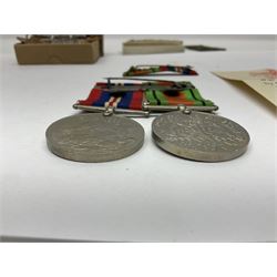 Twelve WW2 medals comprising four 1939-1945 war medals, four Defence medals, three 1939-1945 Stars and Africa Star; all with ribbons; some as groups in two issue boxes with slips