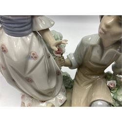 Three Lladro figures, comprising School Chums no 5237, For You no 5453 and Talk to Me no 5987, together with Lladro plaque Art Brings us Together no 7677, all with original boxes, largest example H22cm 