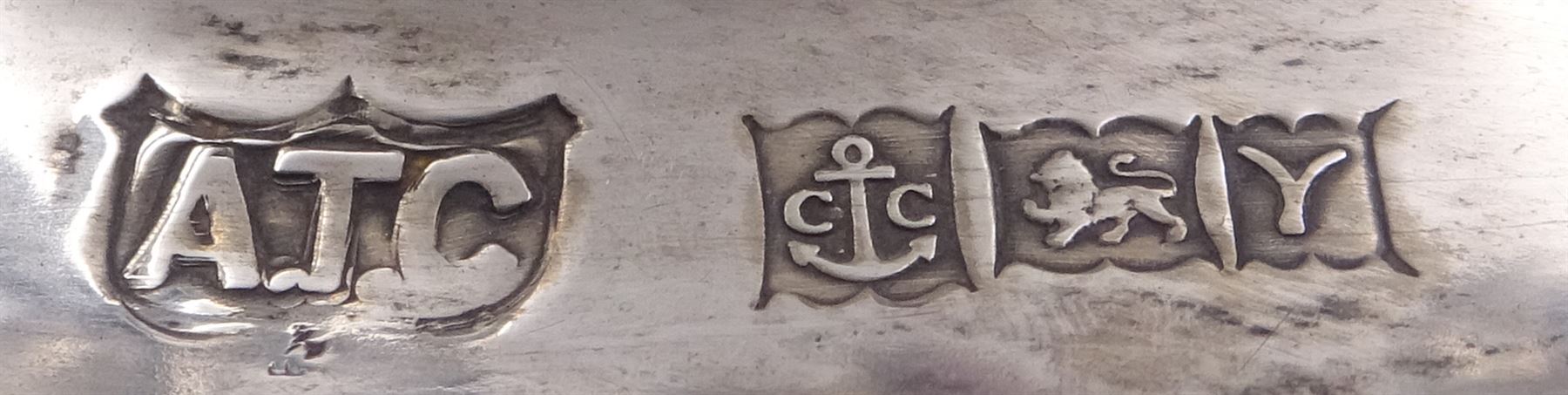 Modern silver mounted three branch candelabra, the tapering stem supporting a central candle holder and two curved branches with candle holders, upon weighted stepped circular foot, hallmarked A T Cannon Ltd, Birmingham 1973, H22.5cm